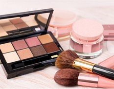 Eyeshadow palette with makeup brushes arranged for eye makeup application