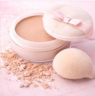Loose baking powder to be applied under eyes to set concealer and reduce creasing