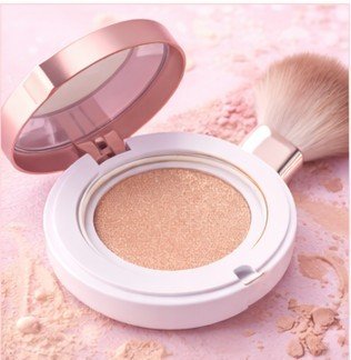Cushion foundation compact with brush applicator for lightweight, glowing coverage