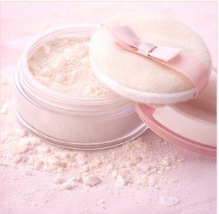 Finishing powder compact with puff for soft, blurred makeup finish