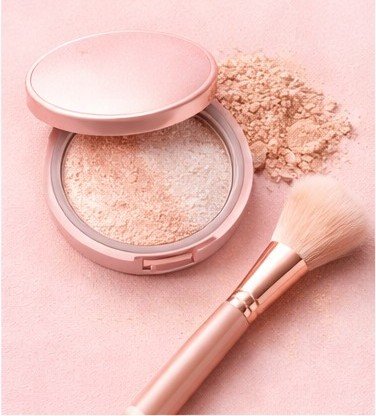 Illuminating powder applied to face for radiant, glowing skin finish