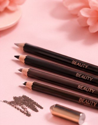 Sharpenable eye pencil used for precise eyeliner application on a pink background